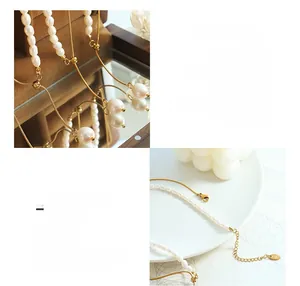 Detailed macro of 18K gold plated titanium steel chain and freshwater pearl tassel closure