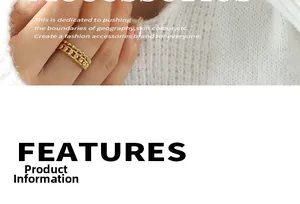 Detail of 18k gold plated double-layer beaded chain rings on hand with white knit sweater