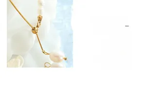 Detailed close-up of freshwater pearl connection and adjustable 18K gold plated snake chain