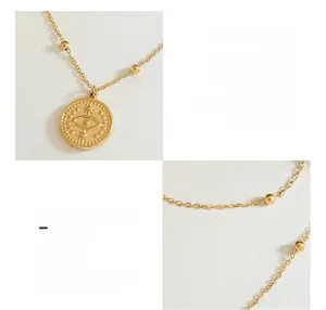 Macro detail of 18k gold plated double layer necklace with evil eye star pendant