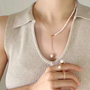 Elegant 18K gold-plated snake chain necklace with freshwater pearls and matching rings