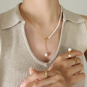 Elegant 18K gold-plated snake chain necklace with freshwater pearls and matching rings