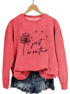 Détail de l'imprimé pissenlit Just Breathe sur sweatshirt corail à manches longues femme