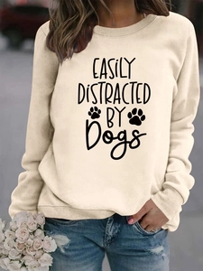 Detail of the crewneck sweatshirt with Easily Distracted by Dogs slogan and paw print