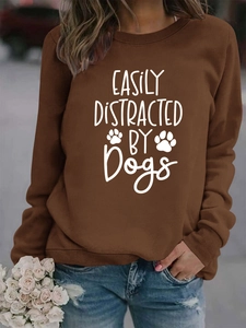 Detail of Easily Distracted by Dogs print on dark brown crewneck sweatshirt