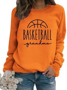 Detail of orange crewneck sweatshirt with black Basketball Grandma print and ribbed cuffs