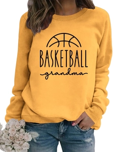 Close-up of yellow round neck sweatshirt with Basketball Grandma print and soft cotton fabric