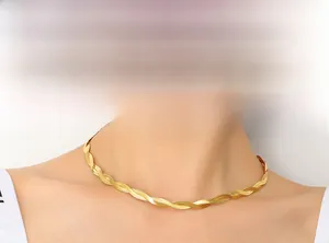 Close-up of 18k gold plated double-stranded twisted snake chain choker on model