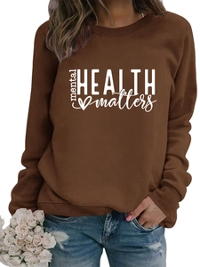 Detail of Mental Health Matters print on brown crewneck sweatshirt with ribbed cuffs