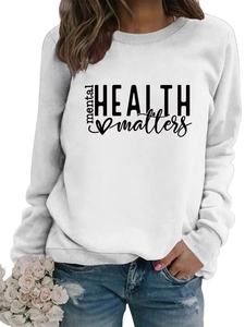 Close-up of ribbed neckline and black Mental Health Matters print on white sweatshirt
