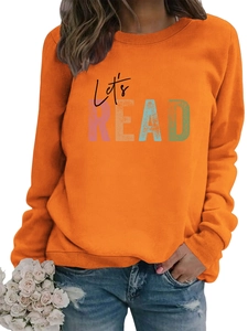 Detail of orange long sleeve sweatshirt featuring Let's READ print and ribbed cuffs
