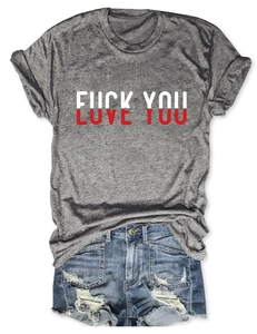 Flat lay of grey short sleeve T-shirt with Love You print and ripped denim shorts