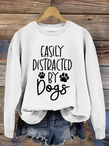 Detail of Easily Distracted by Dogs print on white long sleeve crewneck sweatshirt