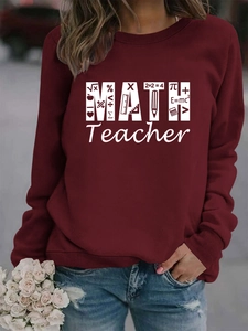 Detail view of burgundy sweatshirt with white Math Teacher graphic and formula print