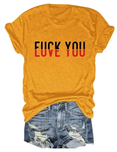 Flat lay of casual yellow t-shirt with creative text print and ripped denim shorts