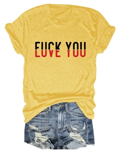 Close-up of Love You slogan print on yellow cotton t-shirt with ripped denim shorts