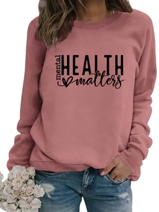 Detail of pink Mental Health Matters sweatshirt with ribbed cuffs and crew neck print