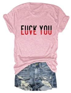 Detailed flat lay of pink Love You print t-shirt paired with distressed blue denim shorts