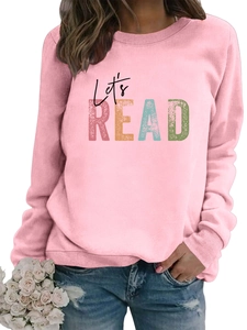 Close-up of Let's READ artistic print on pink crewneck long-sleeved sweatshirt