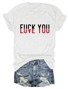 Flat lay of a white short sleeve T-shirt with LOVE YOU print and ripped denim shorts