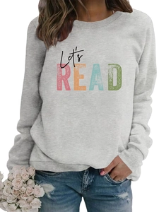 Detail of Let's READ vintage print on loose light grey sweatshirt with soft fabric texture