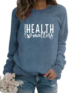 Detail of Mental Health Matters slogan printed on a blue long sleeve pullover sweatshirt