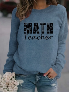 Detail of soft foggy blue sweatshirt featuring bold MATH Teacher print and math symbols