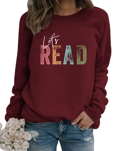 Detail of Let's READ print on burgundy crewneck sweatshirt with ribbed cuffs and neckline