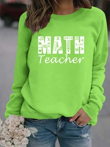 Detail of bright green crewneck sweatshirt with Math Teacher print and math icons