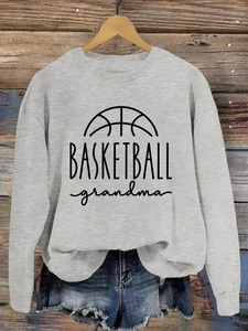 Gray crewneck sweatshirt with Basketball Grandma print displayed on a wooden hanger