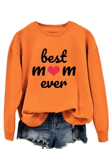 Detail of Best Mom Ever orange sweatshirt featuring bold black font and a small red heart