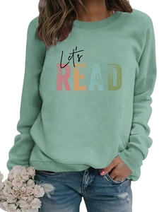 Detail of ribbed cuffs and sage green fabric texture on Let's Read printed sweatshirt