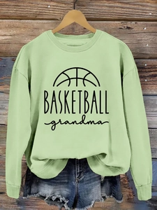 Detail of light green Basketball Grandma sweatshirt with soft knit texture and print