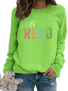 Detail of bright green crewneck sweatshirt with colorful Let's READ pop art print
