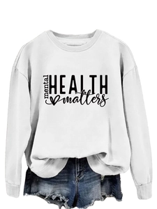 Detail of white cotton crewneck sweatshirt with black 'Mental Health Matters' print text