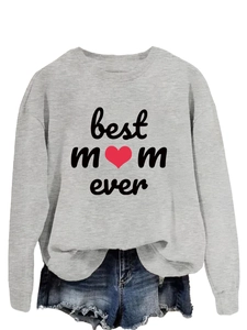 Detailed flat lay of a grey Best Mom Ever sweatshirt with denim shorts on white background