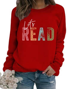 Detailed view of ribbed neckline and Let's Read vintage print on dark red sweatshirt