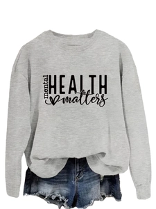 Detail of grey crewneck sweatshirt featuring black mental health matters print design