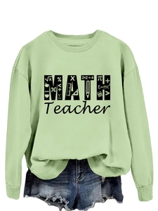 Detail of light green math teacher sweatshirt featuring black mathematical formulas print