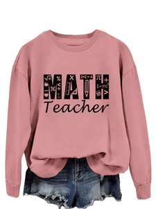 Close-up of math teacher graphic crewneck sweatshirt and distressed denim shorts