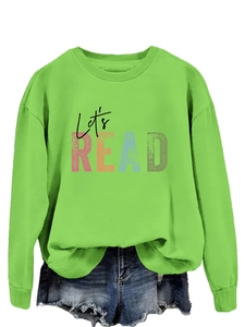 Close-up of vibrant green sweatshirt with Let's READ colorful letter print design