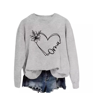 Light gray crewneck sweatshirt with Oma heart print paired with blue denim shorts