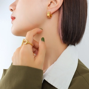 18K gold plated C-shaped zircon earrings and geometric hollow ring set worn by model