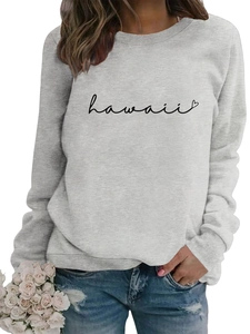 Close-up of ribbed neckline and minimalist Hawaii heart print on light grey sweatshirt