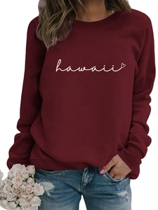 Detail of Hawaii heart script print on a deep red long-sleeved crewneck sweatshirt
