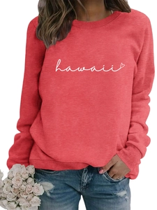 Detail of coral red sweatshirt featuring white Hawaii script and ribbed cuffs texture