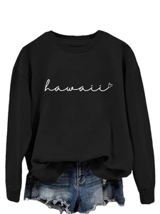 Detail of black long-sleeve sweatshirt with white Hawaii script and small heart print