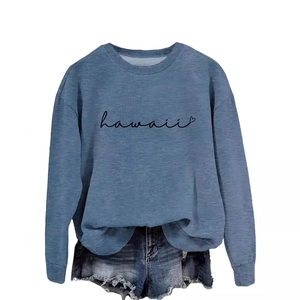 Blue long sleeve crewneck sweatshirt featuring Hawaii print paired with denim shorts
