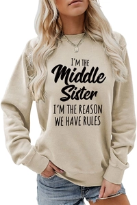 Close-up of I'M THE Middle Sister slogan print on beige long sleeve crewneck sweatshirt