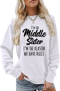 Detail of 'I'M THE Middle Sister' slogan print on a white long-sleeve crewneck sweatshirt